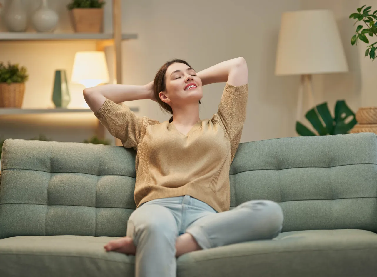 woman relaxing on sofa